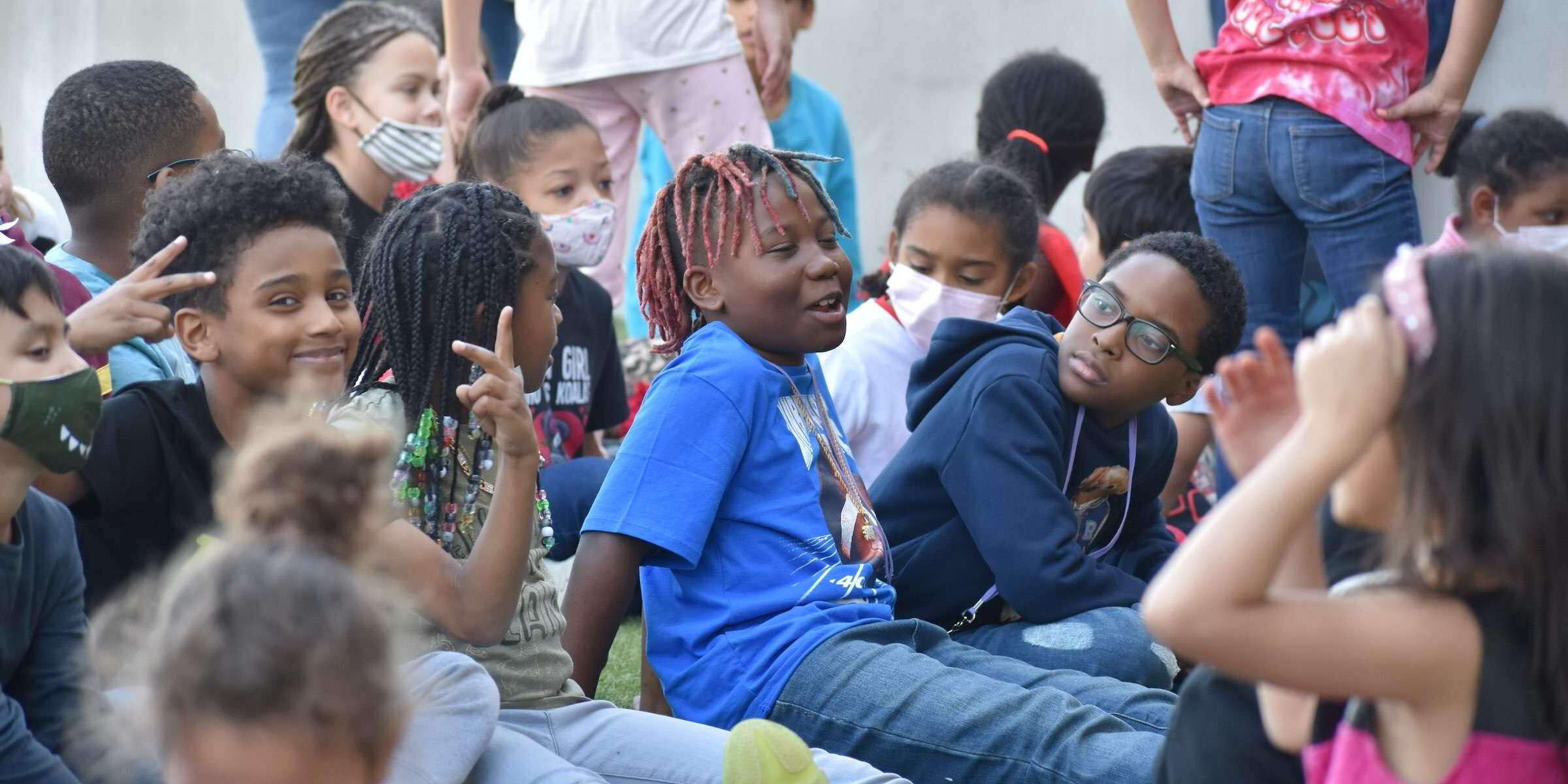 students sitting outside